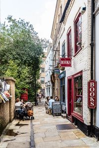 A bookshop down a pretty alley in Cambridge, England. Cambridge University is one of the best day trips from London.