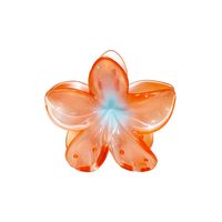 Inspired by the plumeria flower, the super bloom hair claw clip represents love and new beginnings. Effortless yet playful, this claw clip is large enough to hold a full head of hair. Color: Nectarine Pearl Measurements: 3 1/4” x 3” x 2” Flower Claw Clip Copyrighted Design