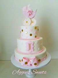 White, pink, and gold baby shower cake More