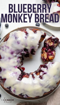 Blueberry Monkey Bread is a pull-apart treat made with layers of soft, buttery homemade dough and a sweet, tangy blueberry sauce, all drizzled with a cream cheese glaze. It’s perfect for breakfast, dessert, or as a snack any time of the day!