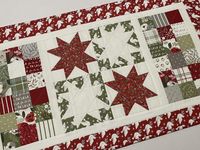 For your winter and Christmas decor, this patchwork quilted star table runner features a collection bright and cheery enough for that special day with roses and flowers, holly, doves, plaids - as well as dots and stripes.  A big holiday spectrum of reds, greens, greys and snowy whites.   A red dove print frames the star and patchwork blocks.  The double fold binding is machine stitched on, then hand sewn on to the backing, which is a white tonal snowflake print. Reversible. Quilted runner is 19" x 33".  Nicely sized for a dining room table, coffee table or credenza.    Machine quilted. Machine wash gentle, warm. Tumble or air dry. Touch up with a dry, medium heat iron. Hand crafted in my smoke free studio and ready to ship.   Here is the link to my winter and Christmas offering: https://ww