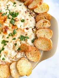 Filled with Fresh shrimp, melty cheeses, minced garlic, and herbs, there's a reason this bubbly cheesy shrimp dip is the best you've ever had.