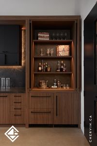 Whether open for display or closed for a sleek, clean look, this pocket door whiskey cabinet is the ideal addition to your kitchen or bar area. Perfectly blending style and functionality, it offers a discreet storage solution for your finest spirits...#PocketDoor #BarDesign #WhiskeyCabinet #KitchenDesign #KitchenCabinet