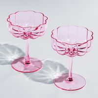 PRICES MAY VARY. Perfect for your next brunch or dinner party, this glassware set features a gorgeous iridescent pattern that perfectly complements any event. Each glass measures 5" in height, 4" in diameter, and has a capacity of 7 ounces. These elegant and colorful champagne coupes are sure to be the perfect accessory to your next birthday celebration, engagement party and more. The set includes two champagne glass coupes that will provide the right amount of character and elegance to any drin