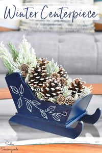 A wooden sleigh that was meant for Christmas decor gets a wintery makeover as a centerpiece to use in January instead! Because, let's face it- winter decorating can be a challenge after the pageantry of the holidays! But a winter centerpiece like this is a great way to enjoy the calm beauty of winter indoors.