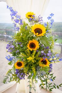 Pedestal arranfement #sunflowers #delphinium #marquee #wedding