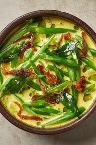 Green beans are gently cooked in a mild, warming spiced coconut sauce in this beautiful Sri Lankan recipe from Kolamba in Soho. It’s also quick and simple to cook, although it’s well worth making the curry leaf oil the night before, too – the way the green oil floats on the surface of the coconut milk is beautiful (and will earn you serious cheffy brownie points too).