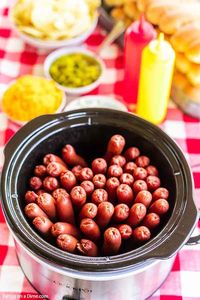 Crock Pot Hot Dogs are so easy and perfect for parties and to feed a crowd. The slow cooker does all of the work and the hot dogs stay warm. It is easy!