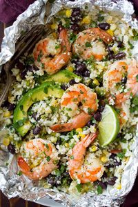 These Cilantro Lime Shrimp and Cauliflower "Rice" Packs are amazingly delicious and they're brimming nutritious ingredients. Perfect summer meal!