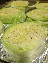 Use a silicon brush and a small bowl with a couple tbsp of olive oil. Dip the brush, lightly coat the cabbage on all sides. Sprinkle with sea salt, pepper, and a squeeze of lemon juice.