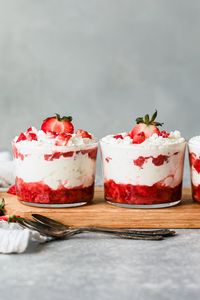 Eton Mess is a classic British dessert made with berries (I used strawberries), whipped cream, and crushed vanilla meringue cookies. You can assemble it in one large bowl or layer it in individual glasses. #dessert #lighterdessert #lowcaloriedessert #glutenfree #weightwatchersdessert