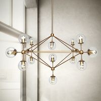 Brushed brass chandelier to add a decadent touch to your room. Paired with our beautiful big round glass fittings, this chandelier alludes a minimalist art deco elegance that is sure to be a statement piece in your space. Choose between two types of glass: clear or frosted         Number of bulbs   15 (3W bulbs are included)       Power   LED 11-15W, 110 - 240V       Fitting type   220v: CE E27 screw in type 110v: UL E26 screw in type       Colour   Brass       Dimmable?   Yes with compatible dimmer switch and compatible bulb.       Illuminated area   10 - 15m2 (107ft2 - 160ft2)        Measurements   73.5cm height (29in) , 115cm length (45in) 70cm drop (28in)       Total package dimensions (with bulbs)     106cm x 106cm x 80cm  ( 38in x 34in x 24in )          Total package weight   15 kg (