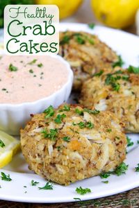 Easy Healthy Crab Cakes - without mayo and oven baked and broiled not fried. The best Crab Cakes recipe that's easy, heart healthy and has no mayonaise. Includes a Greek Yogurt Remoualude Sauce for a dip. Maryland style with very little filler and Old Bay. Includes options to make gluten free. Clean Eating, Pescatarian / Running in a Skirt #crabcakes #crab #pescatarian #healthyliving #fishrecipes #crabrecipes