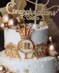 Celebrating in style with this royal-themed cake for a special occasion! 👑✨ The gold accents, custom initials, and elegant pearls bring sophistication to every detail. As a home baker, I strive to make each cake a work of art for your memorable moments. Alhamdulillah for every opportunity to create something this beautiful. 💛 Need a custom cake that adds a regal touch to your celebration? WhatsApp us on 7044955912 to make your vision come to life! 💌 #TheBakingMumma #LuxuryCakes #CustomCakeD...