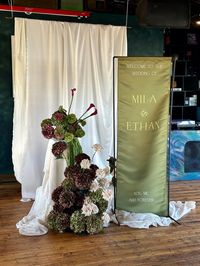 Make your wedding entrance unforgettable with our elegant satin banner, perfect for welcoming guests to your special day. Crafted from high-quality 228gsm satin, this banner exudes sophistication and charm, setting the tone for your event. Customizable Sizes: Choose from a range of sizes to suit your venue and preferences. Whether you envision a statement piece or a subtle accent, we have the perfect size for you. Fully Customizable Design: Personalize your banner with ease. Select any backgroun