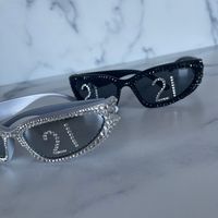 Sunglasses with frames covered in crystals and crystal numbers on the lenses featuring 21 for a unique 21st Birthday Party Accessory and One of a Kind Gift.  Select any number you want as these are custom made to order. A fun way to celebrate someone's 21st Birthday in Attention Getting Style.  Want a different number? Use the Personalize section to confirm a number other than 21 as shown. Personalize the number for sports fans, sports teams, any birthday like 40th birthday, 21st birthday, playe