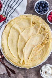 Thin homemade crepes that are so EASY to make using only 6 ingredients, served hot or cold with toppings. A great crepe recipe!