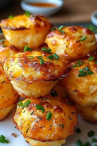 Golden Cheesy Potato Puffs arranged on a white platter