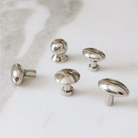 Effortlessly elevate your space with our handcrafted hardware knobs. Skilled artisans carefully create each piece, showcasing unique character and craftsmanship. Designed for both beauty and durability, they are the perfect finishing touch for kitchens, bathrooms, offices, and laundry rooms. Choose from five designs to perfectly complement your aesthetic. handcrafted by artisans in India polished nickel (minor imperfections are expected and embraced) all pieces are sold individually each ships w