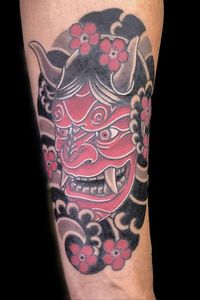 Japanese traditional style "Oni" mask in red and black with white highlights