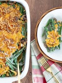 This easy southern green bean casserole recipe from Paula Deen is a traditional side dish perfect for Thanksgiving. Ingredients include green beans, mushrooms, french fried onion rings and cream of mushroom soup. Prep time is about 5 minutes and cooking time is 5 minutes at 350 °F.