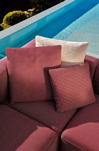 Piero Lissoni's Mex-hi sofa collection takes on a fresh outdoor look, adapting the same modular design originally envisioned for indoor settings to outdoor spaces.