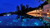 Paresa Resort, Phuket, Thailand, the resorts main pool has starry fiber optic lighting.