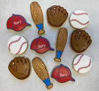 "From end of the season banquets to birthday parties, our baseball themed cookie favors are the hit of the event! This listing features (12) hand-decorated, individually wrapped sugar cookies in your choice of vanilla sugar or lemon sugar flavor: 3\" baseballs 3\" baseball caps 3-1/2\" baseball mitts 5\" x 1-1/2\" baseball bats We do not use added preservatives, so all items are made to order. Unless you request otherwise, your order will be shipped as close to your event date as possible (deliv