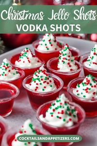 Pretty Christmas Jello shots for your holiday party! Easy to make jello shots made with vodka and cherry jello, topped with whipped cream and holiday sprinkles.