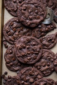 These double chocolate chip cookies will have you reaching for a glass of milk! Double chocolate chip cookies are fudgy, chewy, and easy to make with 10 ingredients. Plus, no chilling the dough so they are ready in 20 minutes. #doublechocolatechipcookies #cookies