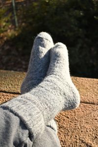 Keep your feet warm and cushioned with these soft heavy weight alpaca boot socks. Alpaca is suitable for all outdoor activities as it keeps your feet warm and dry with its wicking properties. Also great for wearing in the house like slippers. Socks are primarily made with Alpaca and has Acrylic, Nylon, & Elastic added for strength & memory. Inside of sock is knitted in Terrycloth style. The more you wash your socks the more the fiber 'blooms' and gets fuzzy and soft. See label for care.