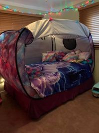 An autism bed tent is quite simply a special needs bed enclosure which removes excessive sensory stimuli to help your little one (or a big one!) get to sleep quicker and more comfortably. #sensory #bed #autism