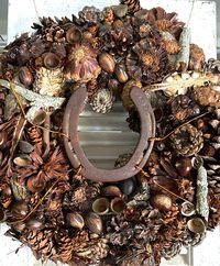 Inspired by my love of both horses and all things nature, this unique, handmade wreath features a mix of fabulous dried elements, harvested from our farm, that complement each other so beautifully. This stunning piece will add a touch of nature anywhere you hang it and it would enhance a masculine space, as well.  The horseshoe adds some good luck!  This wreath would be a perfect housewarming gift or a thoughtful gift for birthdays, weddings, or any occasion! It would also be a wonderful addition to your own mantles and doorways, offering your guests a delightful welcome to your home. Or use the wreath as a fabulous centerpiece with a battery-operated candle in the center. There are just so many wonderful options!  Our wreaths are lovingly handcrafted right on the historic Traveler's Rest