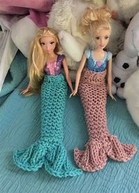 Free Knitting Pattern for Barbie Mermaid Tail - Slip on tail designed for 11.5 inch dolls. Designed by Emi Harrington. Pictured project by ChristineLH. Aran weight yarn.