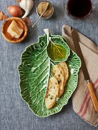 Inspired by nature's bounty, this emerald green Bordallo Pinheiro cruciferous leaf dish and dip bowl earthenware plate celebrates healthy living and eating.