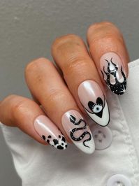 Update your manicure with devilishly cute Halloween acrylic nails that capture the holiday's spooky spirit!