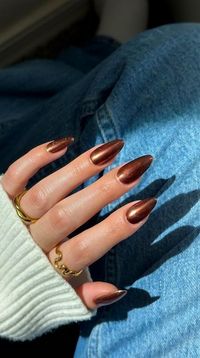 Dayanna Issey Sapiens showcases a stunning chocolate chrome nail look on Instagram, featuring the jelly brown shade from Gelcare. Check out her profile for all the details and links. Perfect for fall, these nails are a must-see for anyone looking to embrace the season's trends. #chromenails #nailsofinstagram #nailstagram #nailsoftheday #brownnails #fallnails #nails