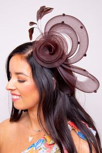 Unique and fun! Let's Go Fascinator is a crinoline flower bow headband detailed with wispy faux feathers and playful dots. Crinoline All Sales Final on Hats and Fascinators. Colors may vary on different devices.