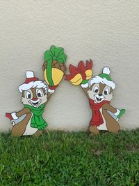 Welcome these Chip and Dale Holiday Yard Signs to your front lawn today! These are handcrafted Yard signs using 1/2 plywood, hand painted with acrylics and then coated with Rustoleum Clear Coat which is applied to the front and back to help with weather protection. The backs are painted with grey paint. **These signs do not come with a stand included, however they will stand up if they have something to lean on.** Item Measurements: Chip: 26 x 17 Dale: 32 x 14 Please note that these items are ma