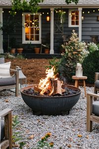 A fire pit can be a focal point for outdoor gatherings. You don't need an expensive model; a simple ring of stones or a basic store-bought fire pit will do the trick. It's perfect for roasting marshmallows and keeping warm on chilly evenings.