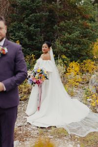 alice shoots people, utah fall elopement, utah mountain elopement, groom in purple suit, bridal updo, biracial wedding couple, wedding couple, wedding pose ideas, utah wedding photographer, destination mountain wedding, bright and colorful wedding photos, pearl necklace, couple poses with height difference, wedding gown, wedding ball gown, wedding dress with detached sleeves, wedding dress with puff sleeves, cathedral veil, pearl wedding earrings, fall wedding inspo, fall elopement inspo