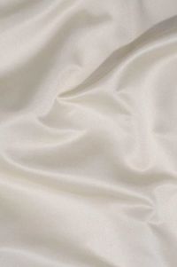 Blush Ivory Silk Duchess Satin Fabric is a heavyweight, luxurious, soft, and shiny fabric with a beautiful pearly sheen and a matte back. Gracious and stylish fabric for special occasion garments that characterizes with crisp volume very easy to work with. The fabric is sold by the Yard, and measures 54 inches in width.