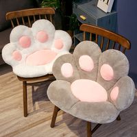 Bring the Fluffiness of Cat Paws into Your Home! Step into a world of cuteness with our Giant Cat Paw Shaped Chair Cushion Plush! Designed with ultimate comfort and whimsy in mind, this delightful piece is a must-have for all cat lovers out there.A giant plush cushion shaped like an adorable cat paw, it comes in a range of delightful colors to match your decor and your mood. Whether you're a devoted cat parent or a lover of all things kawaii, this chair cushion brings the perfect touch of feline