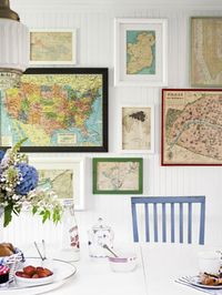 In the breakfast nook, framed maps creatively chronicle the family’s travels.  Love it