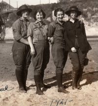 1921 Women hikers in Santa Cruz, Ca (a beach town near mountains of redwood trees.) These gals must be part of a hiking club: they are all wearing similar clothes.