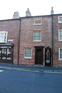 These back to back houses are run by the National Trust to offer a glimpse into the lives of the poor in Birmingham from 1840-1970. http://www.nationaltrust.org.uk/birmingham-back-to-backs/