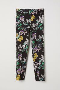 Black/floral. Ankle-length slacks in woven stretch fabric with a regular waist. Concealed side zip, mock back pockets, and tapered legs with slits at hems.