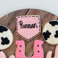 Emilee Fyffe on Instagram: "These cookies were so fun to do for a 1st birthday party 💗🐮💗 #sugarcookies #customsugarcookies #buttercream #buttercreamfrosting #homemade #homebaking #homebaker #cowcookies #rodeocookies #1stbirthday #cowgirlcookies"