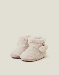 Toasty toes, always.Keeping your feet warm and your loungewear looking luxe, this pretty pair has a boot silhouette with pom-pom detailing. Perfect for nights in. Cream