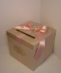 "*Please read shop announcement!! http://www.etsy.com/shop/bwithu This listing is included: 1 tier card box (any color) Ribbon and bow ( any color ) Crystals (Gold or Silver) Brooch on the bow Rhinestones trim (Gold or Silver) around the slot Rhinestones all over the box. Monogram(Oval or Rectangle )w/crystals ♥Do you want to upgrade to Swarovski Crystal all over the box ? just add $20.00USD!! http://www.etsy.com/listing/91666052/swarovski-crystals-for-wedding-card-box ♥ Card boxes hold at least